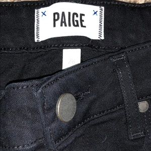 Black PAIGE skinny jeans.